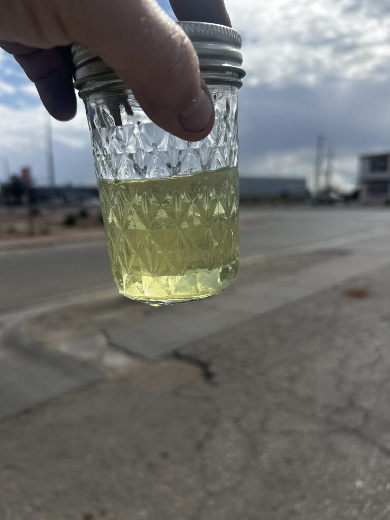 A jar of clear fuel after filtering