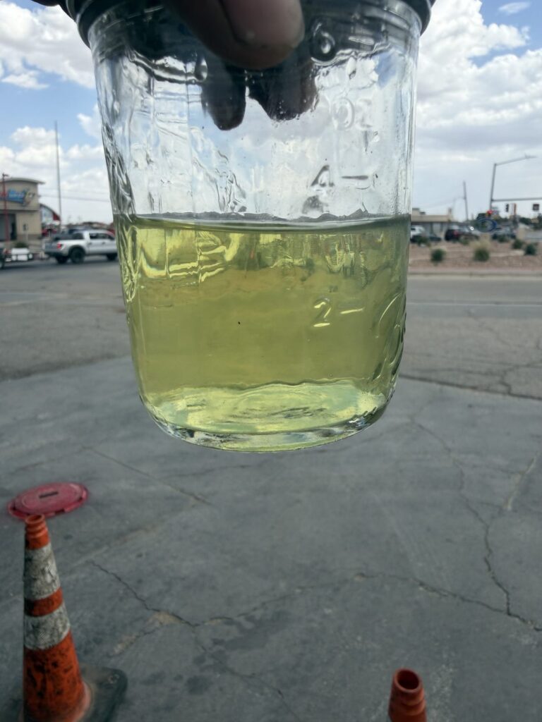 A jar of clear fuel after filtering